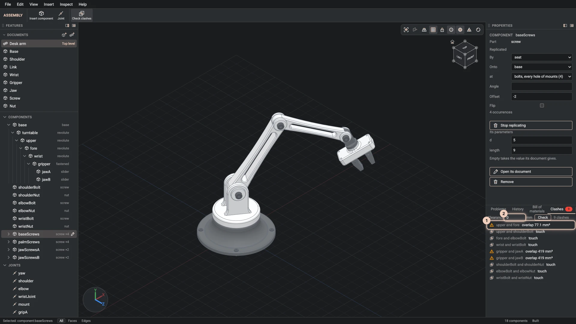 The desk arm's clashes: two small overlaps with the volume each shares, and the screws and bolts touching what they hold
