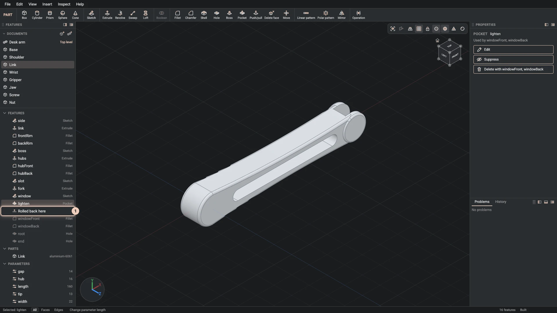 The link rolled back to its lighten pocket: the marker under it, the later fillets and holes greyed and left out of the build