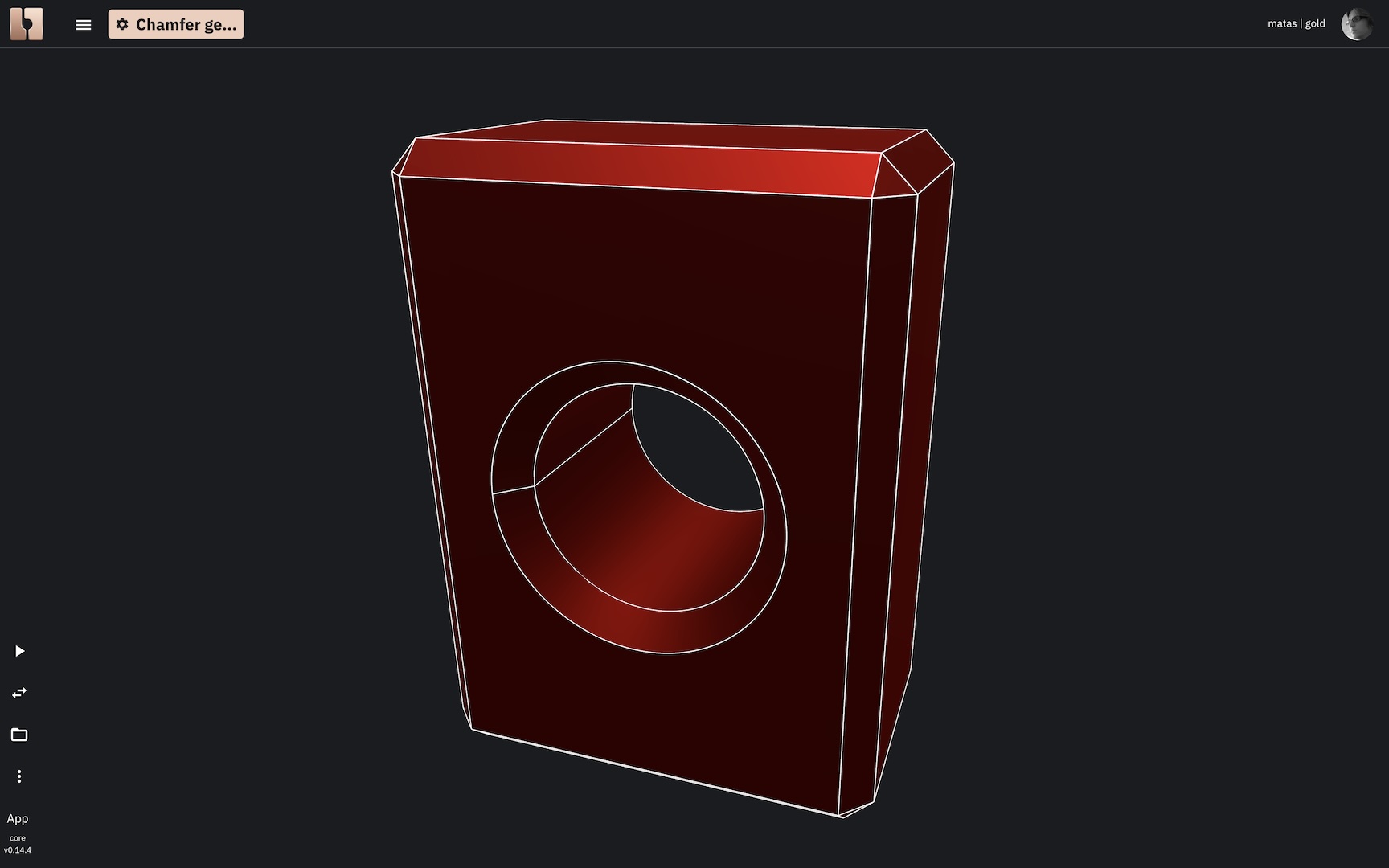 A 3D solid box with a cylindrical hole, where the circular edges of the hole have been chamfered, creating a beveled entry.